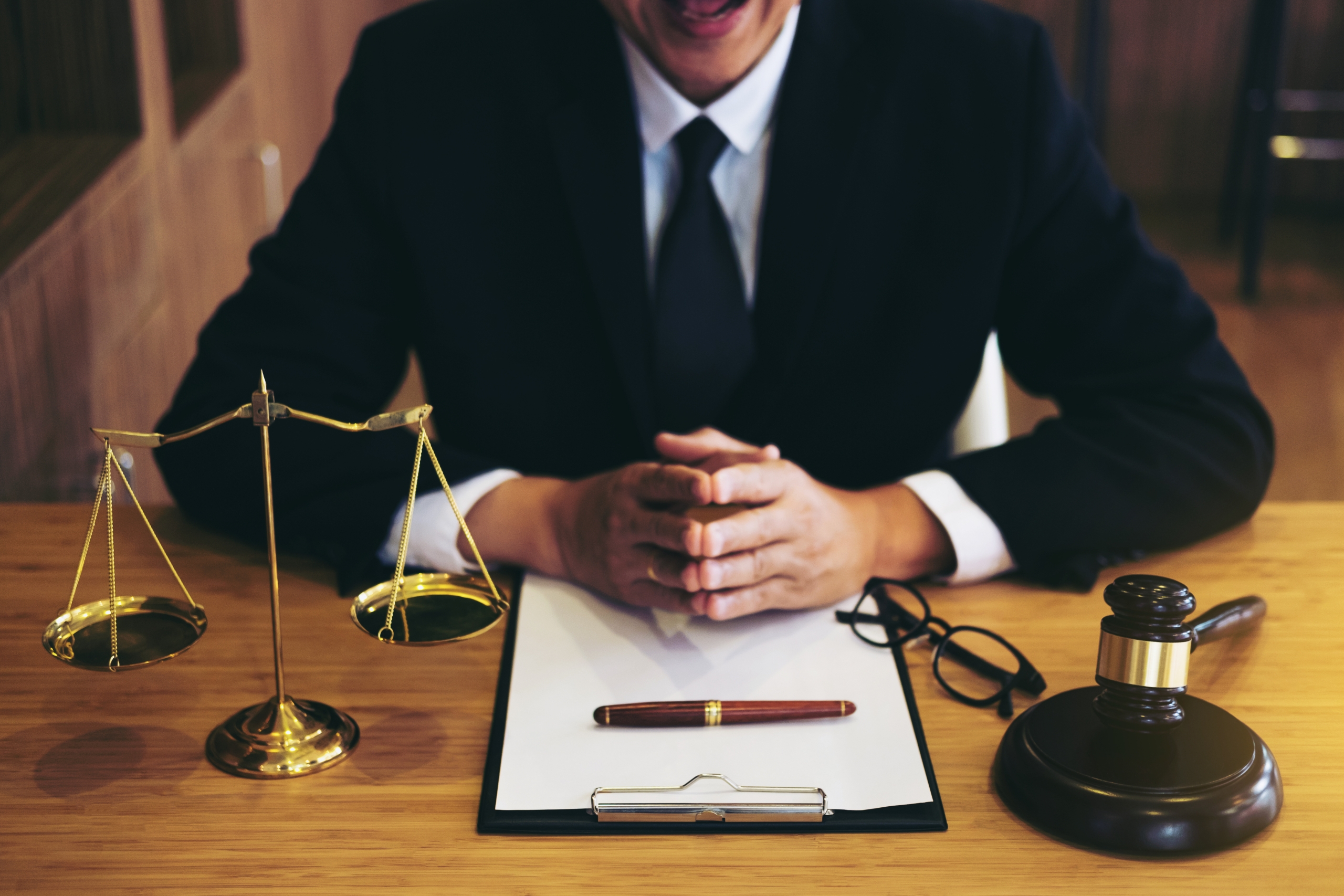 Judge gavel with Justice lawyers, Businessman in suit or lawyer working on a documents. Legal law, advice and justice concept.