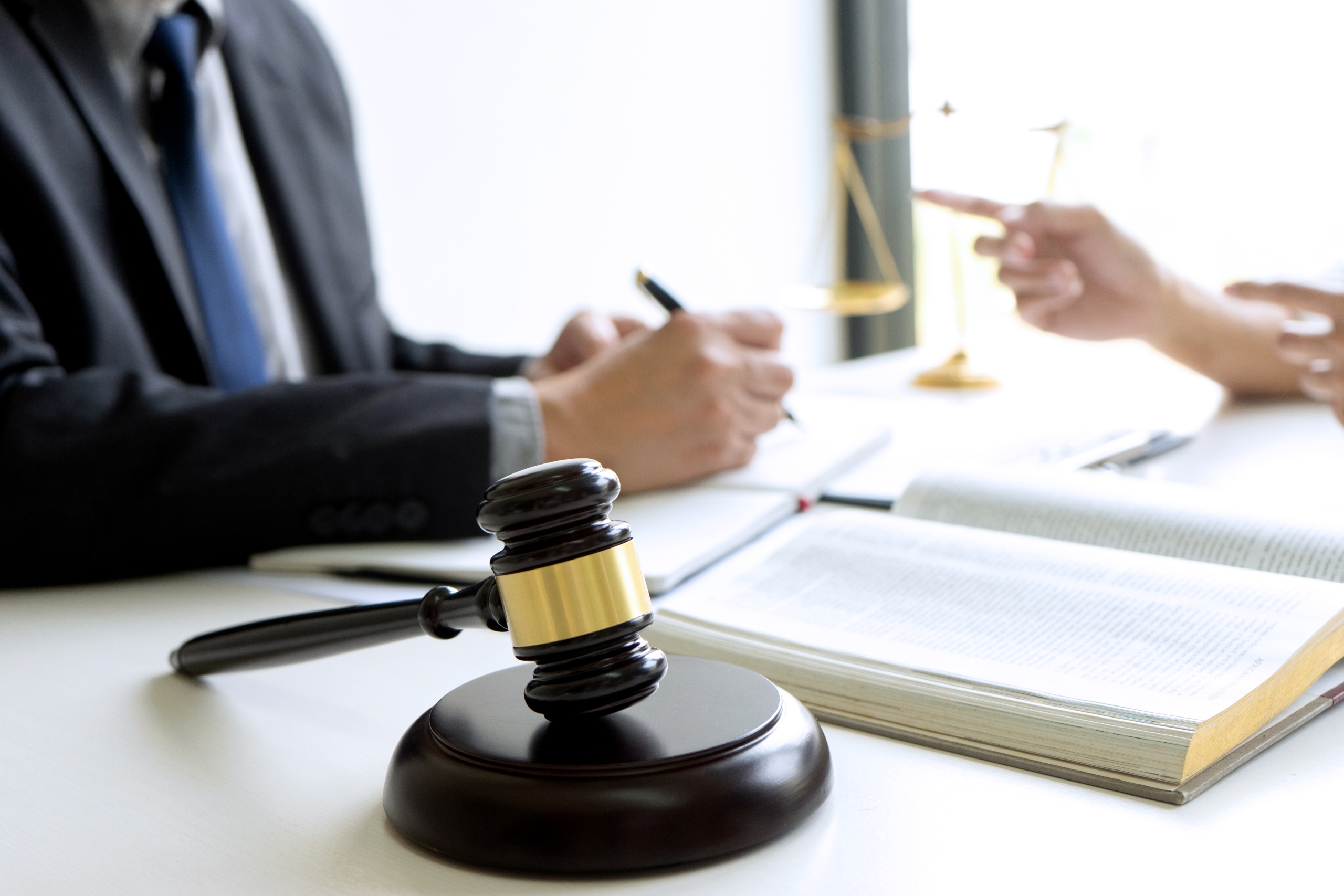 Judge or lawyer talking  with team or client about consult law detail and prepare to sign contract agreement, law firm concept.